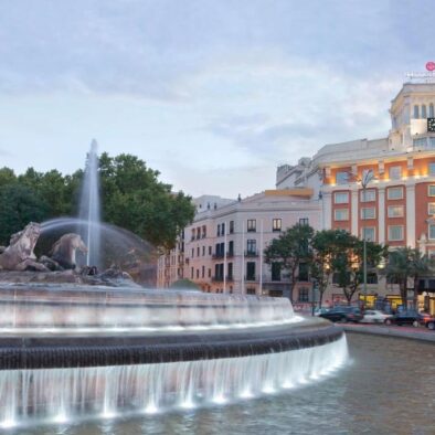 Neptuno fountain and NH Paseo del Prado hotel in Madrid